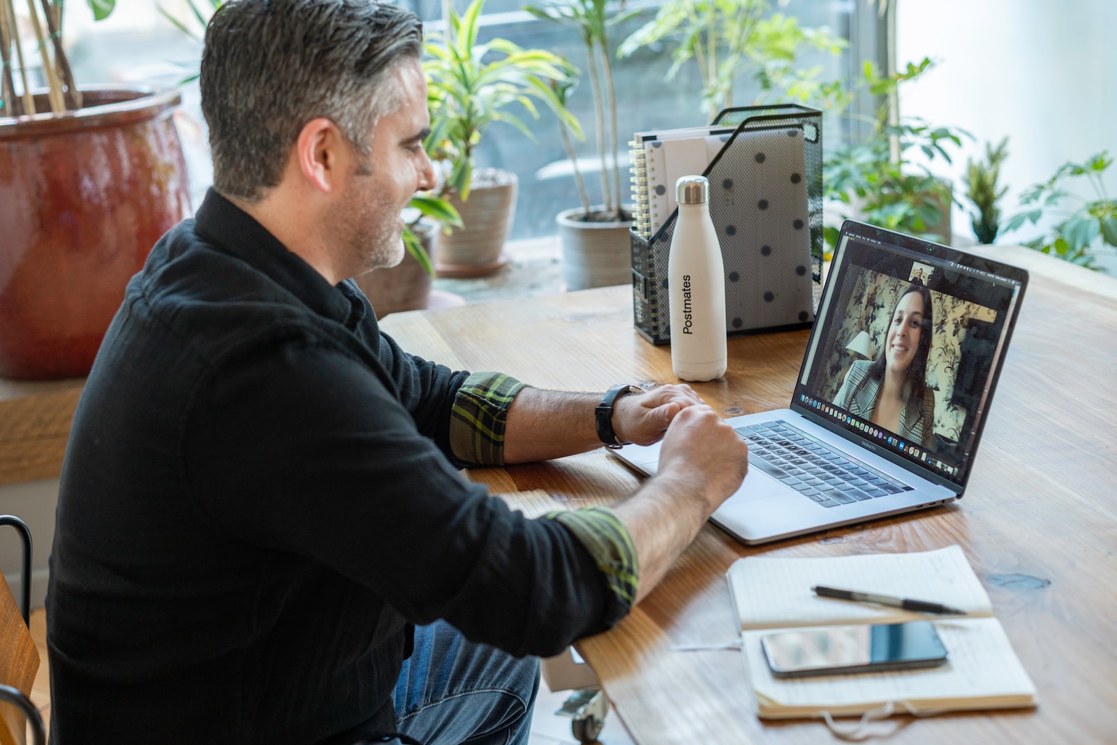 Photo by LinkedIn Sales Solutions man in black sweater using macbook pro