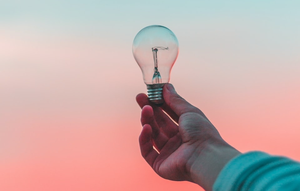 person holding light bulb